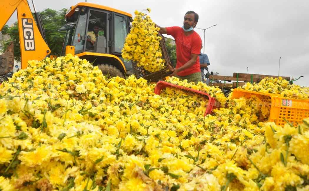 Flowers Traders dumping in the trash