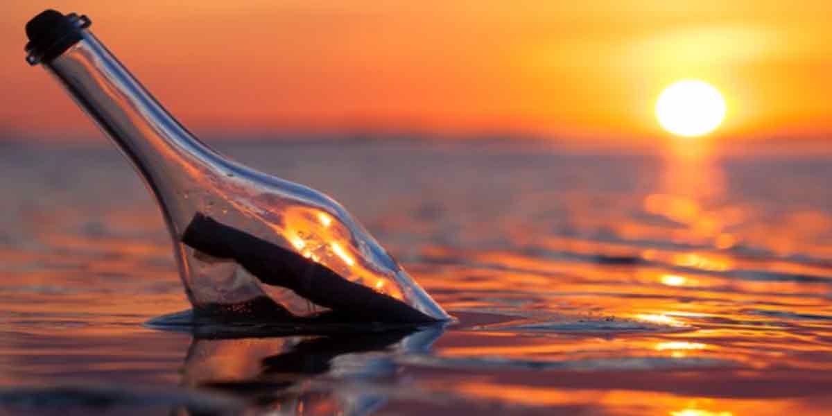 Mysterious liquid bottle floating in the sea