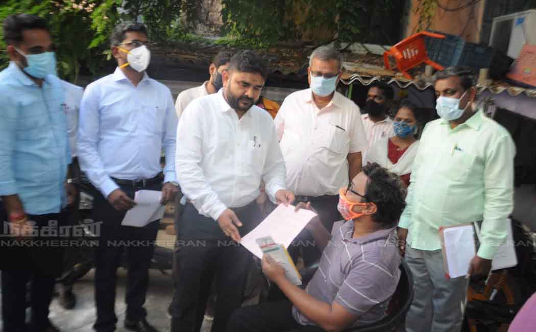 election Officer issuing postal ballot form