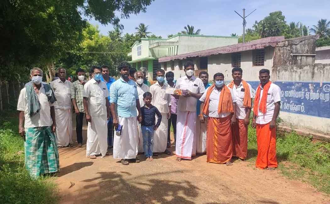 Villagers celebrating the birthday of an honest village administration officer