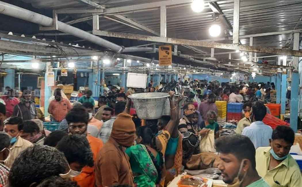 People gathered at the fish market