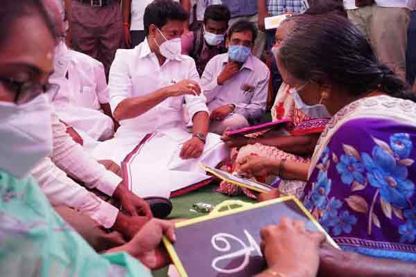 Minister Anbil Mahesh who taught the elders to hold hands and write ..!