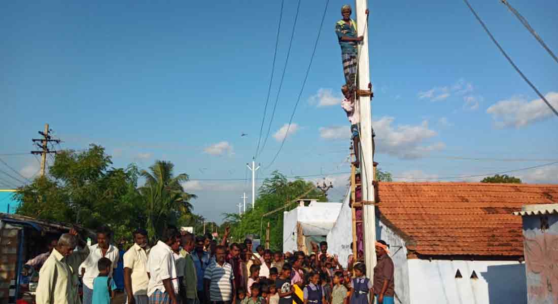 Civilians who climbed the electric pole protesting