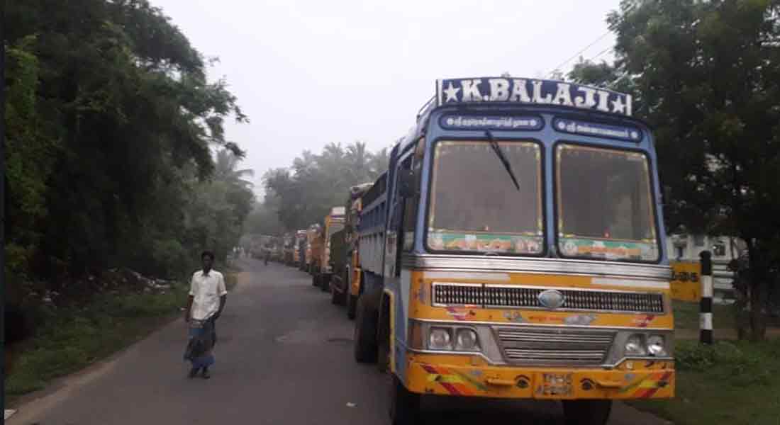 11 trucks carrying sand