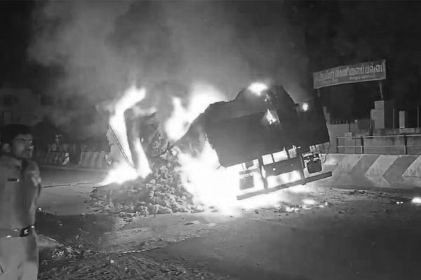 Lorry catches fire after hitting roadblock