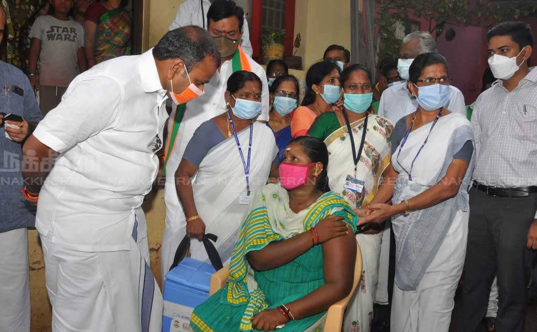 L. Murugan who went door to door campaigning to get vaccinated