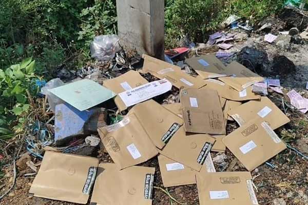 Hundreds of postcards thrown on the road in Kalugumalai