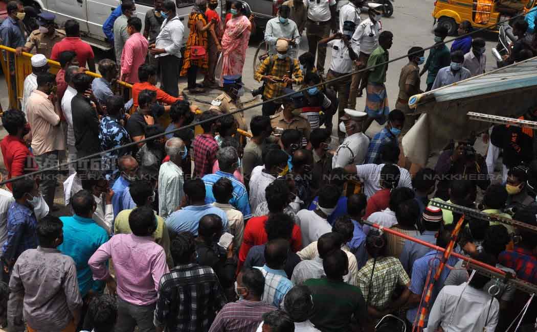 Merchants block the road to open shops