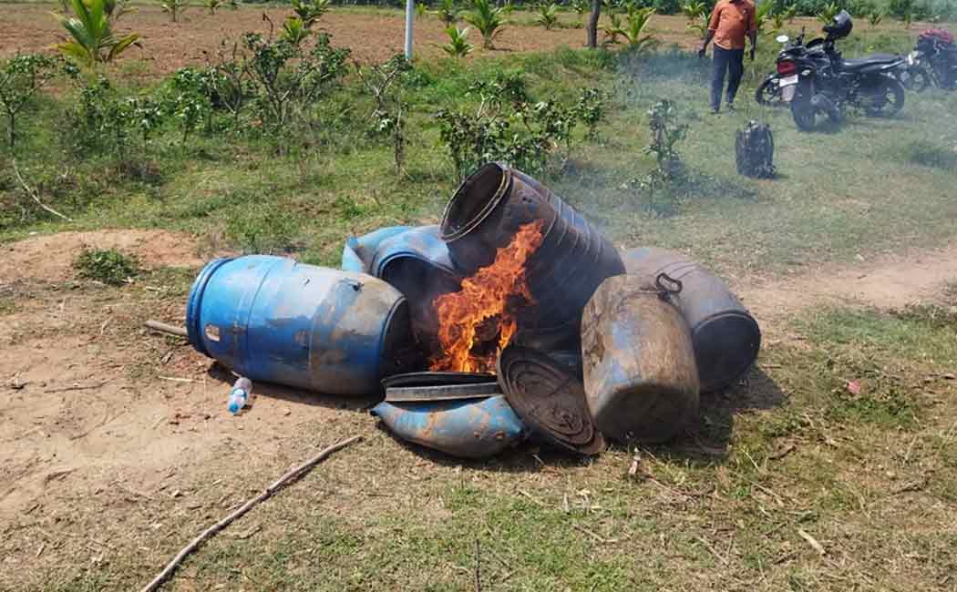 Police destroyed 1100 liters of liquor and set the barrels on fire