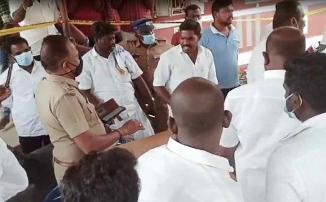 People involved in a road blockade condemning the police