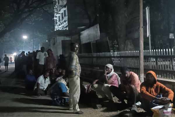 People waiting at the door of ration shop at night to renew Aadhaar card!