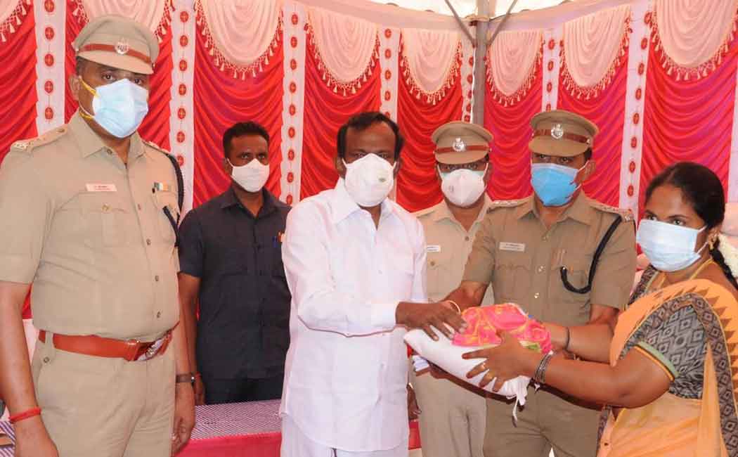 Minister Muthusamy who provided welfare assistance to the police