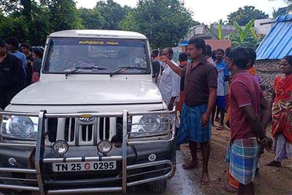 van surrounded by people