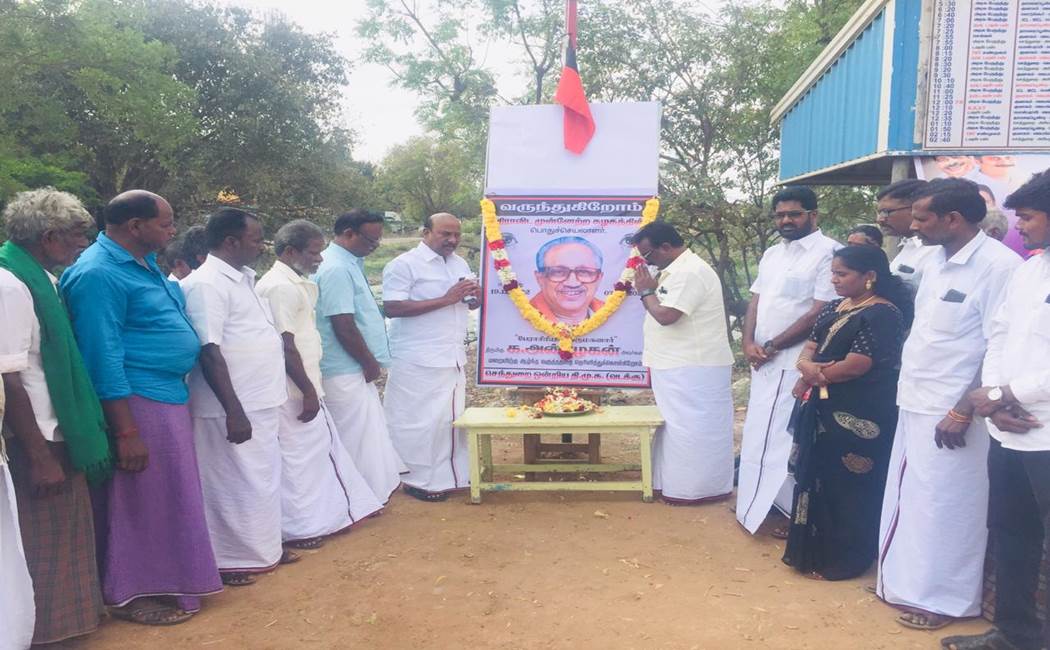 DMK people pay floral tribute KAnbazhagan