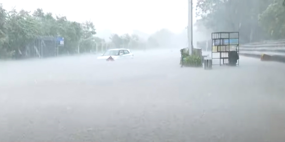 Pond Sivananda Road; A car submerged in rainwater