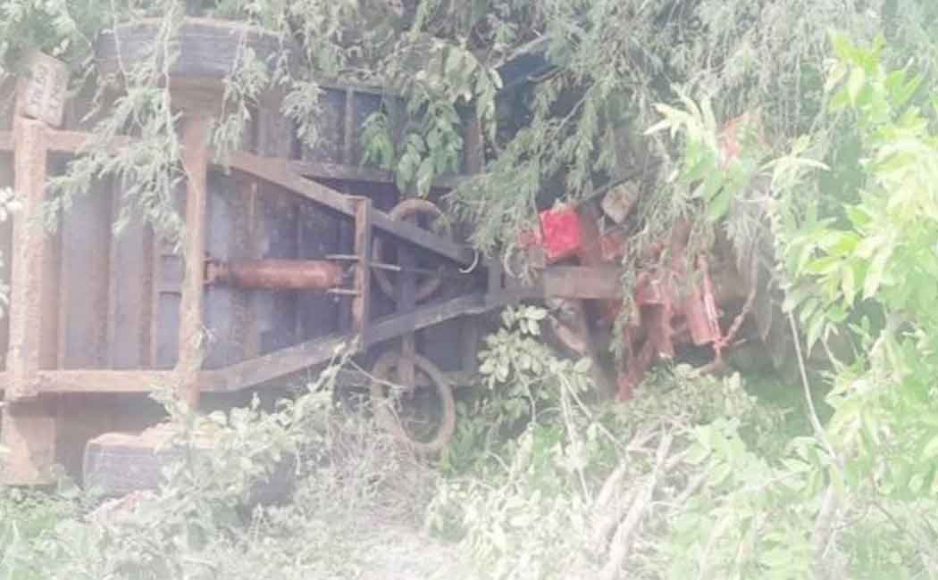 Tractor crashes into 15-foot ditch