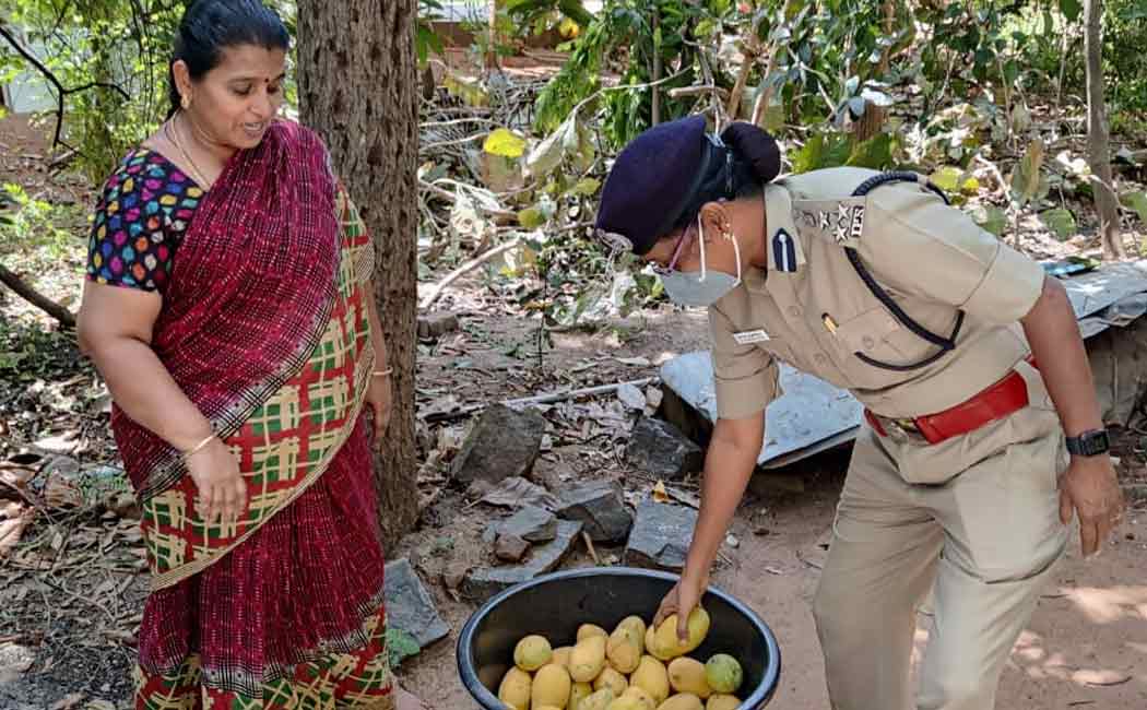 Deputy Chief of Police receiving fruits from farmers and giving them to front field workers ..!