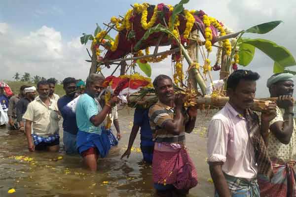 Shame on carrying a corpse in waist-deep water!