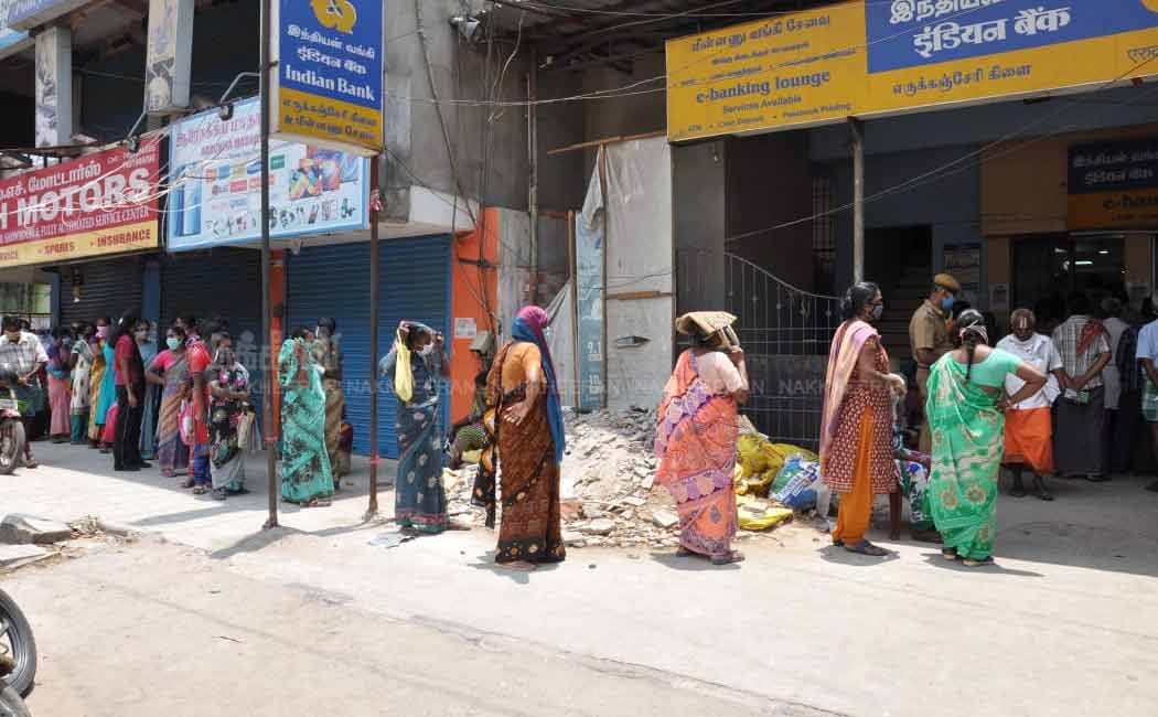 People waiting in long queues in Indian bank