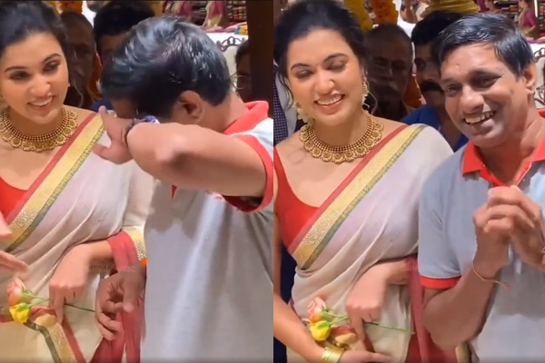 A fan who came to take a photo with Anju Kurien fell on his feet