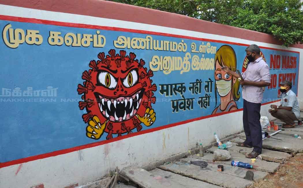Corona awareness pictures painted on the wall of the train station