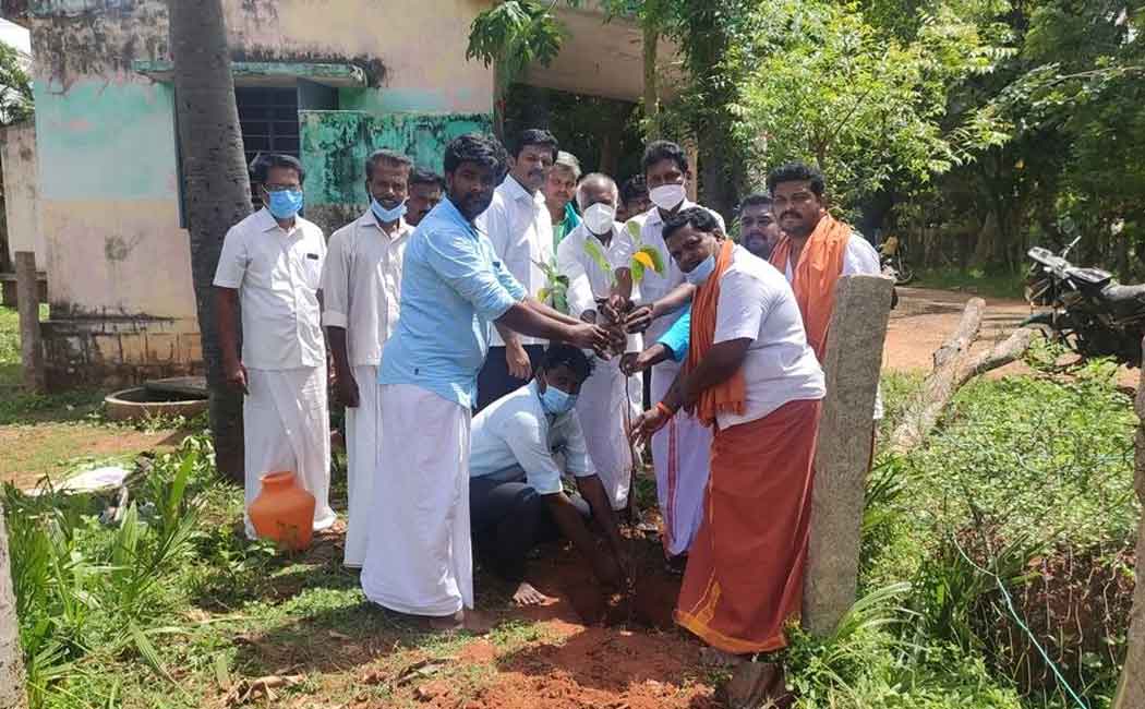 Villagers celebrating the birthday of an honest village administration officer