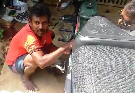 confident motorcycle mechanic Srinivasan ... !!