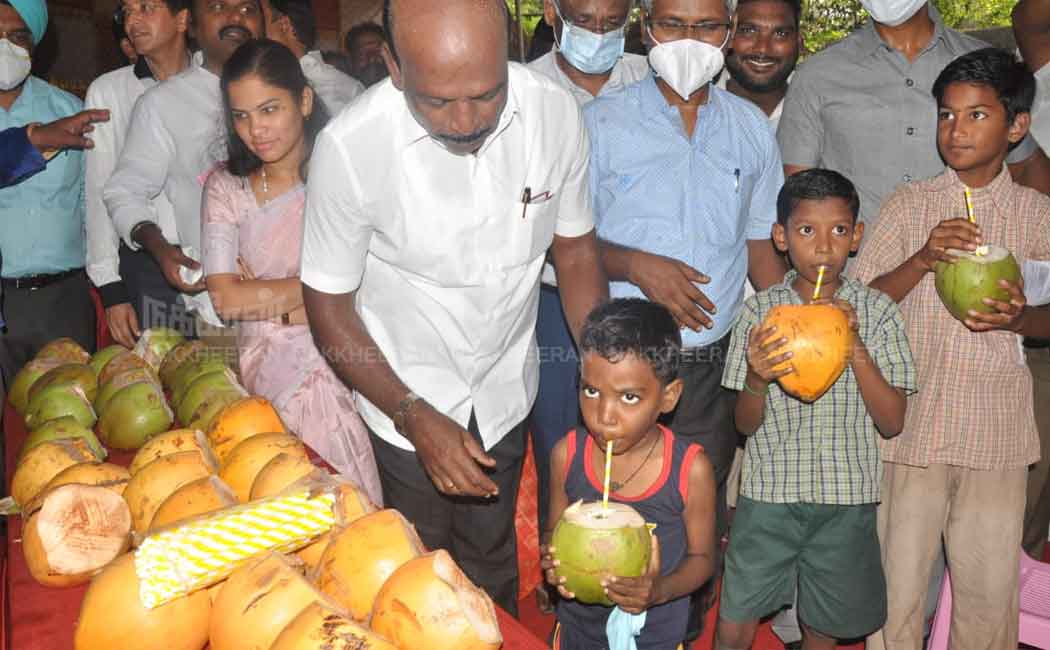 Minister Ma Subramanian giving Elanir to students