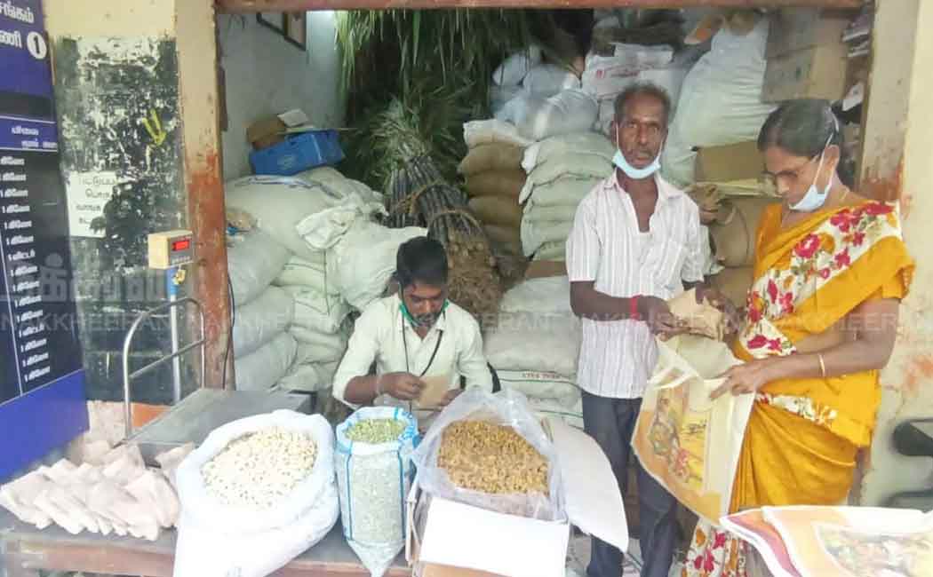 Staff distributing tokens for Pongal gifts
