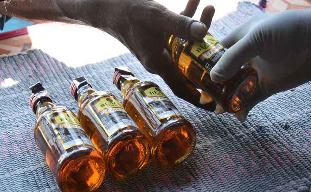 Police selling liquor bottles with bizarre tactics