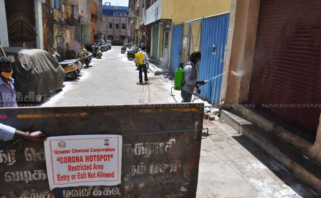 Corporation employees in the process of setting up a barrier