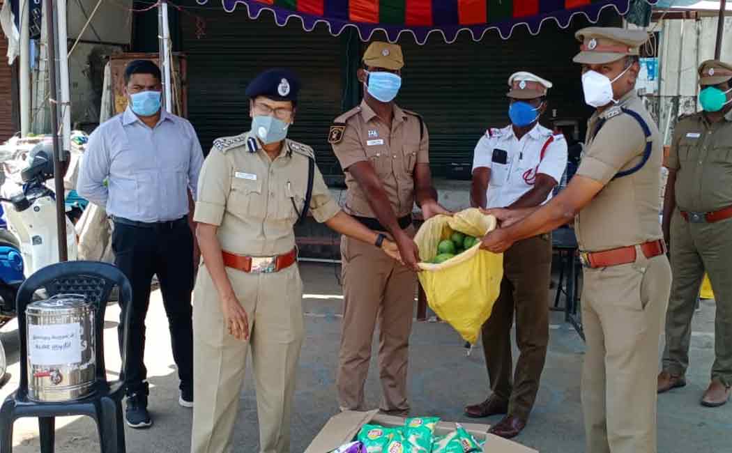 Deputy Chief of Police receiving fruits from farmers and giving them to front field workers ..!