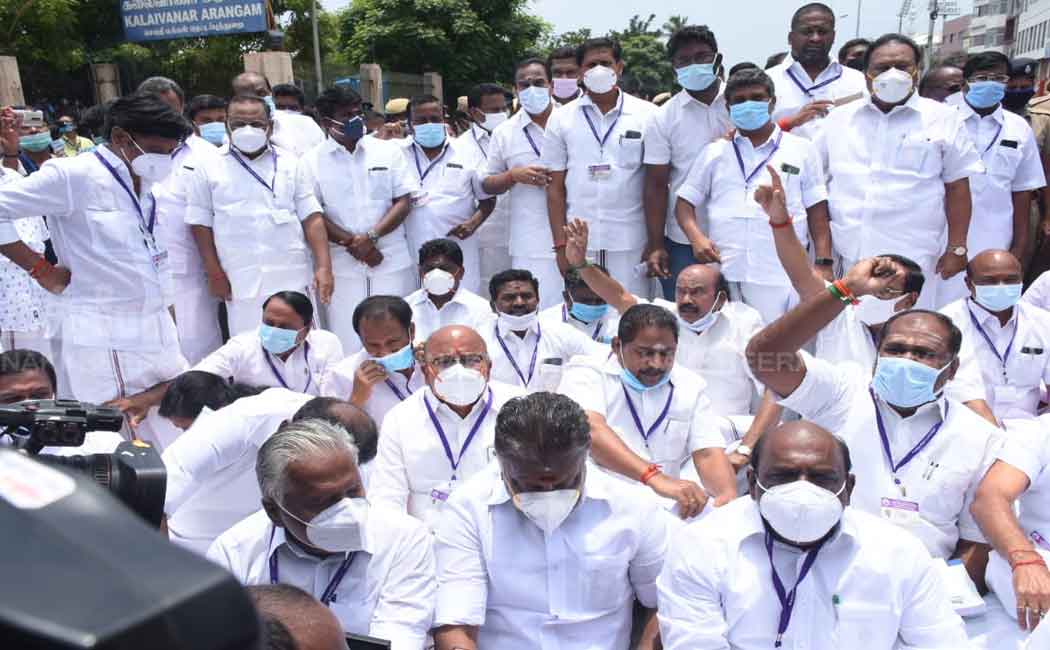 AIADMK MLAs sit on the road