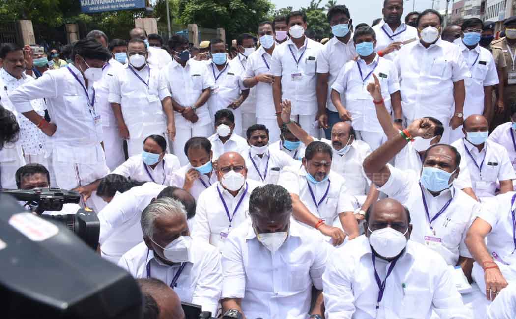 AIADMK MLAs sit on the road