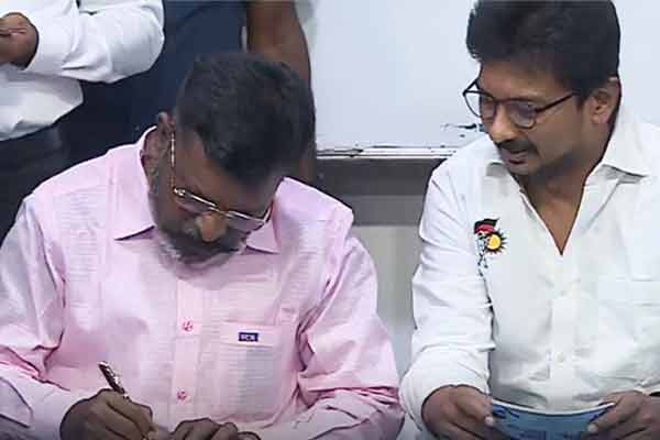 Minister Udayanidhi Stalin receiving the signature from Thirumavalavan