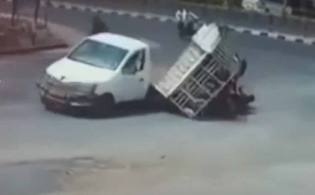 Head-up truck with passengers in the middle of the road