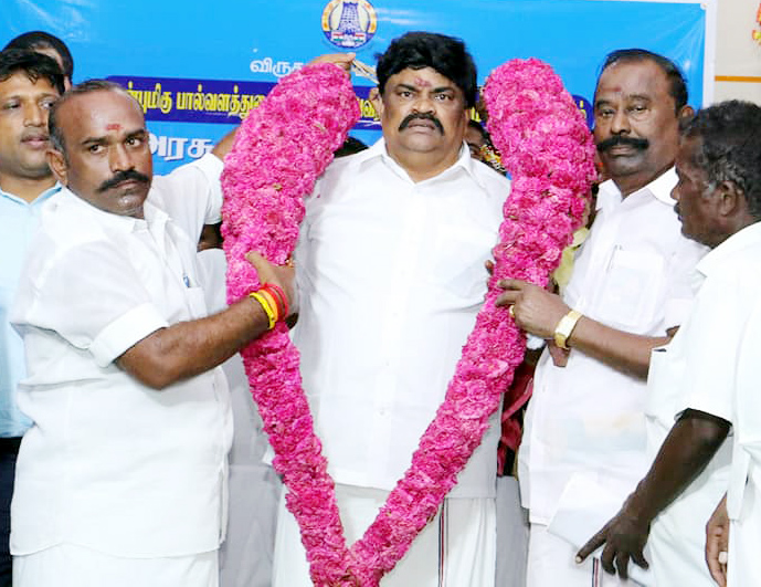 What is the relationship between Baghdad and DMK? -