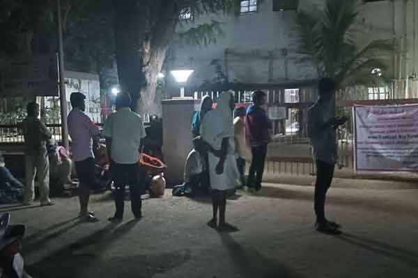 People waiting at the door of ration shop at night to renew Aadhaar card!