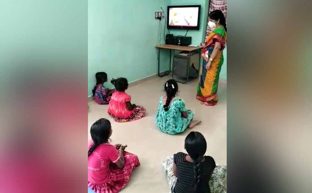 Teacher visiting students home to teach them