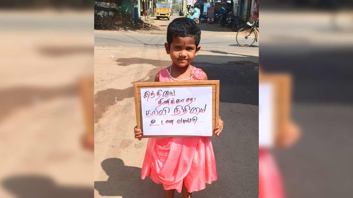 'Don't impose Hindi; provide education funds immediately' - girl's banner campaign