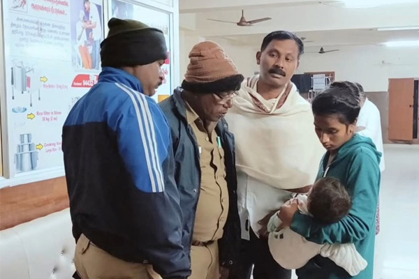 2 children lying in front of the charity home