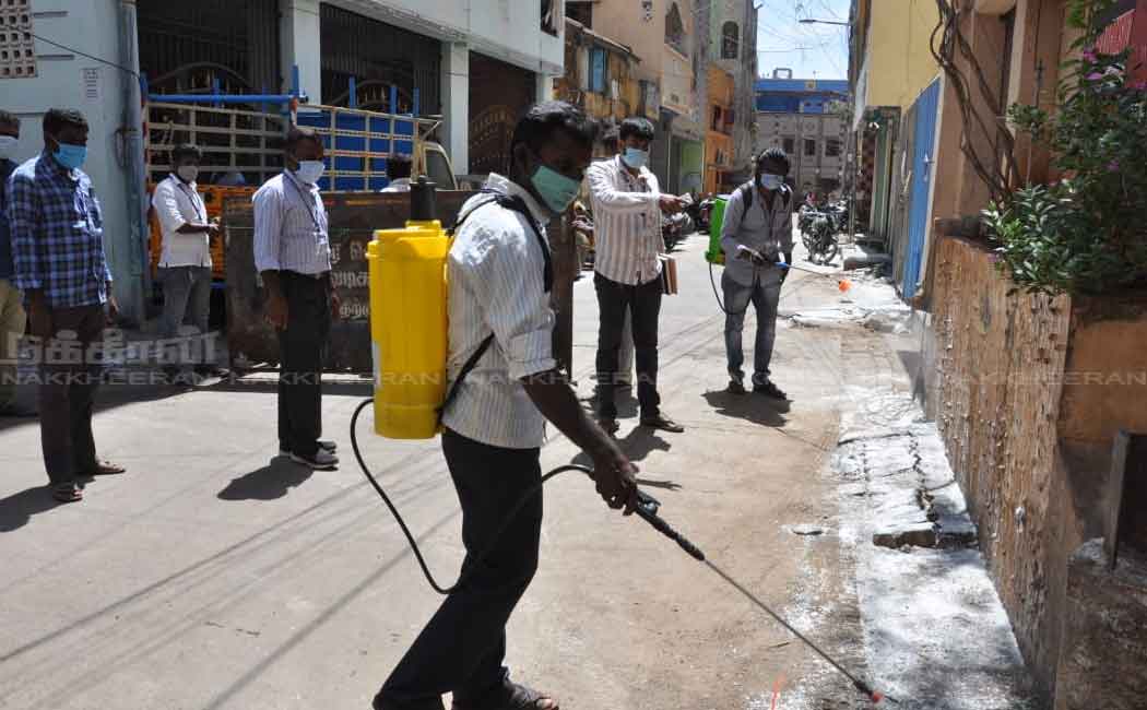 Corporation employees in the process of setting up a barrier