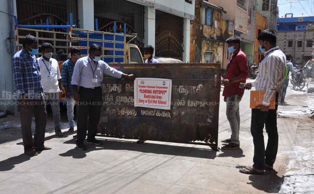 Corporation employees in the process of setting up a barrier