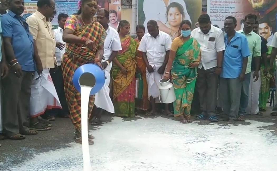 Demonstration pouring milk on road demanding increase milk procurement Puducherry