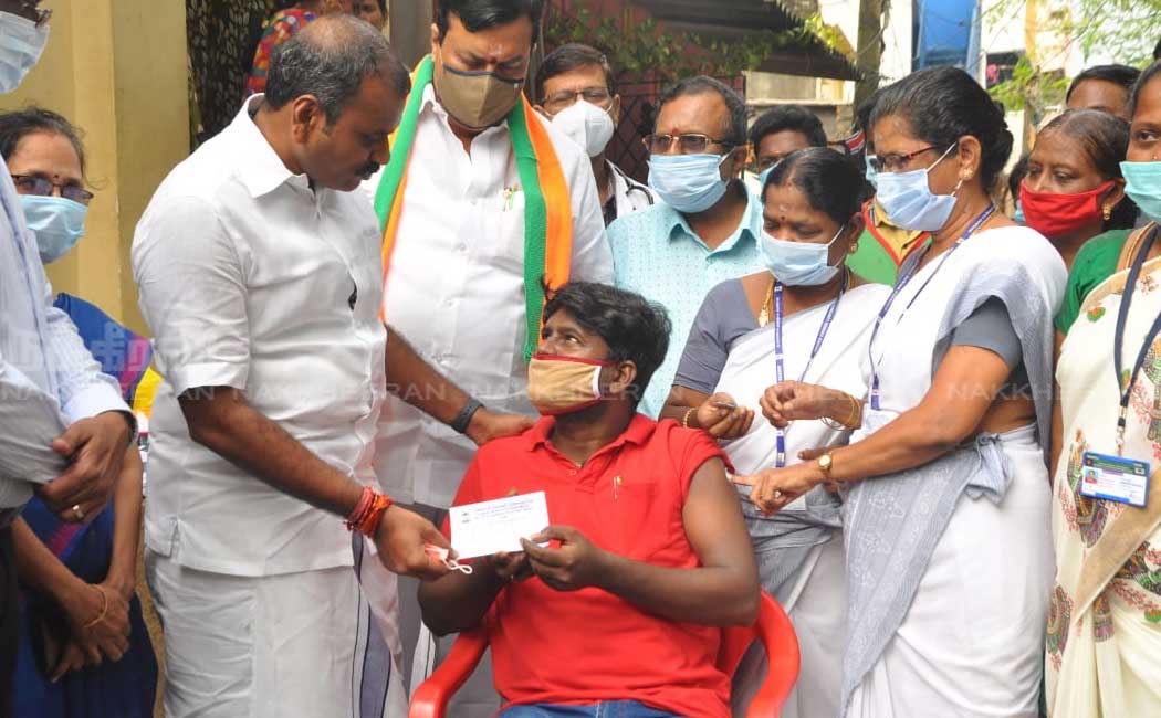 L. Murugan who went door to door campaigning to get vaccinated