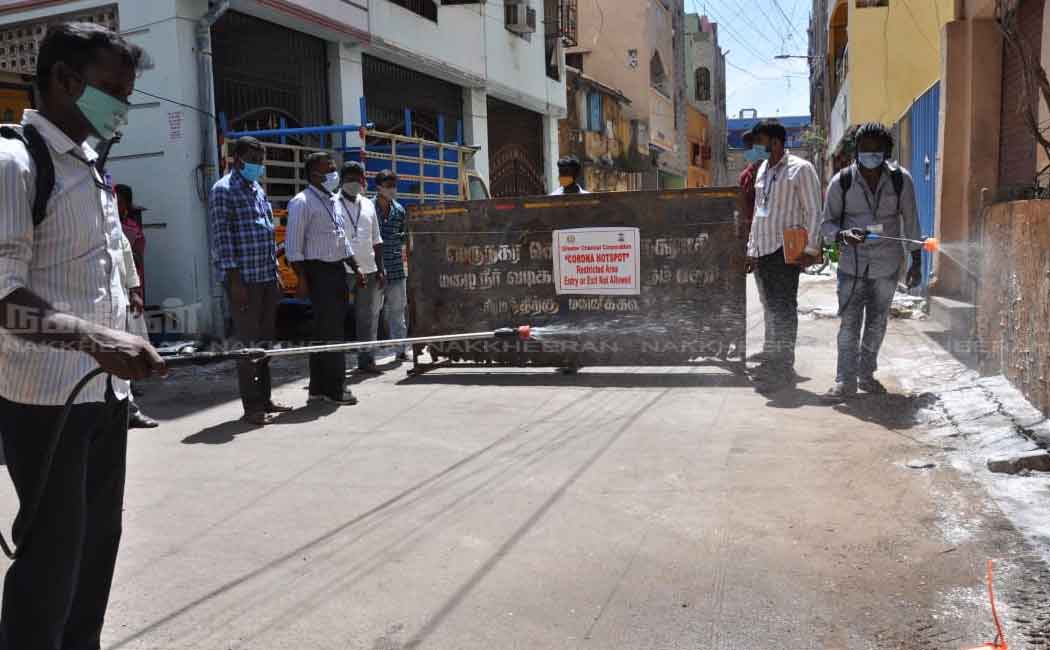 Corporation employees in the process of setting up a barrier