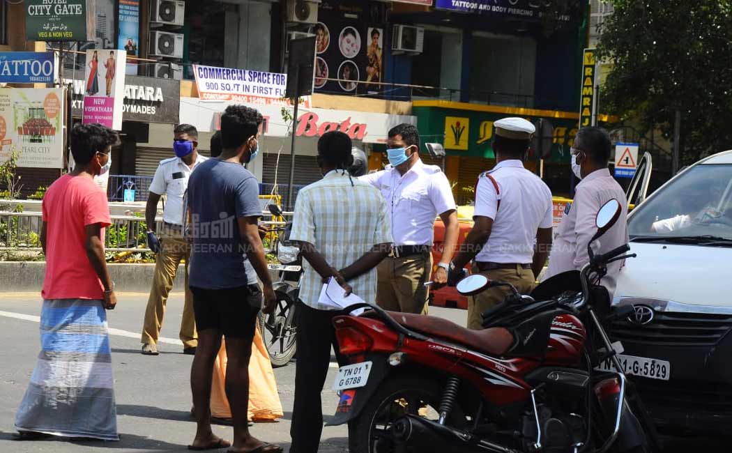 Police who confiscated vehicles without e-pass in chennai