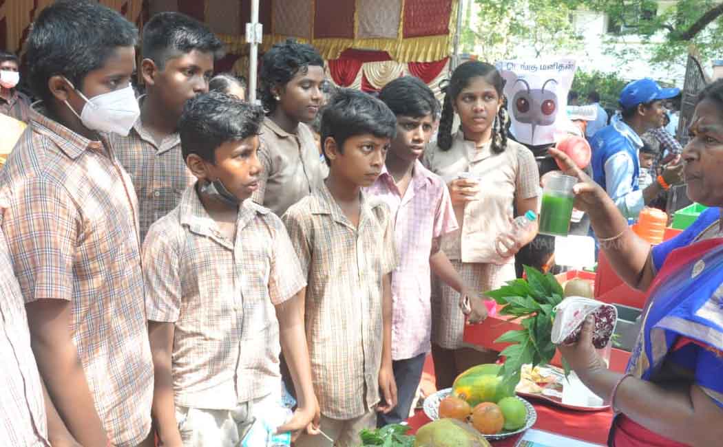 Minister Ma Subramanian giving Elanir to students