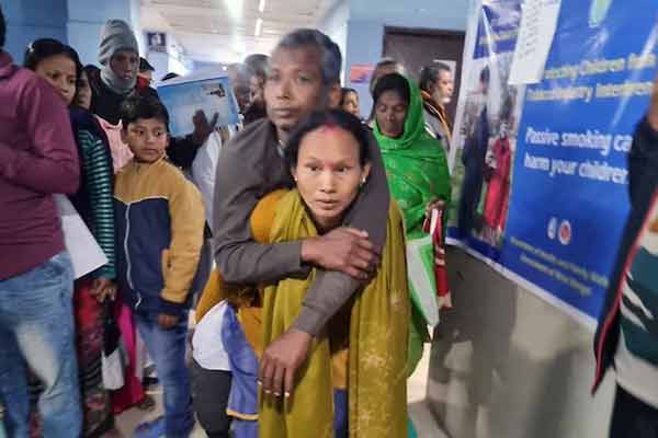 A woman carried her husband on her back because no wheelchair was provided in west bengal