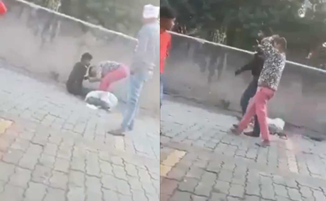People who beat and women in the middle of the road in uttar pradesh